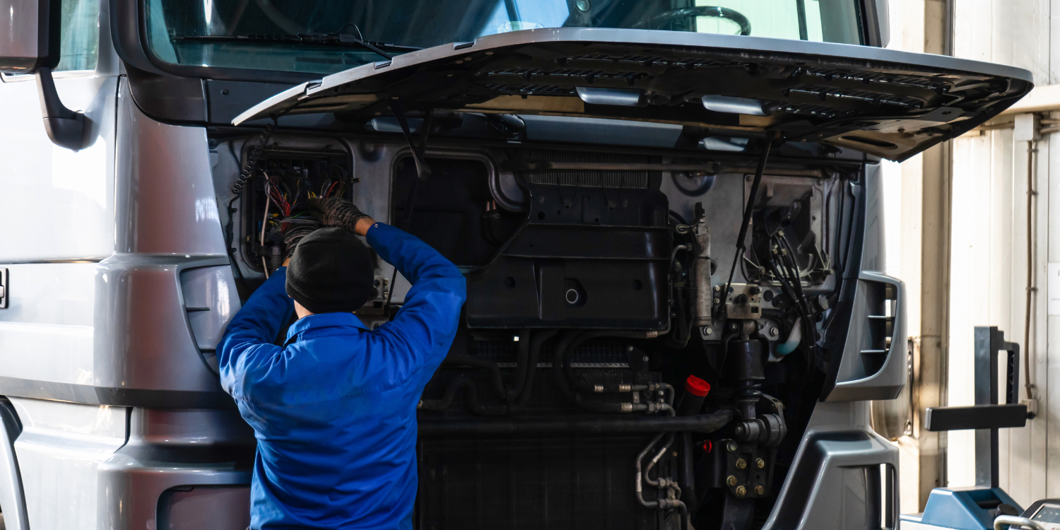 Mechanic fixing a bus engine - How to Diagnose Starter Cranking Problems