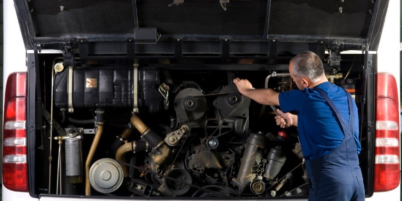 Man Fixing Bus alternator