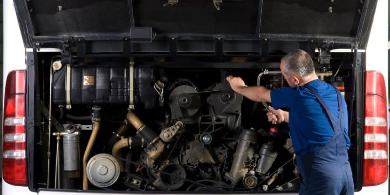 Man Fixing Bus alternator